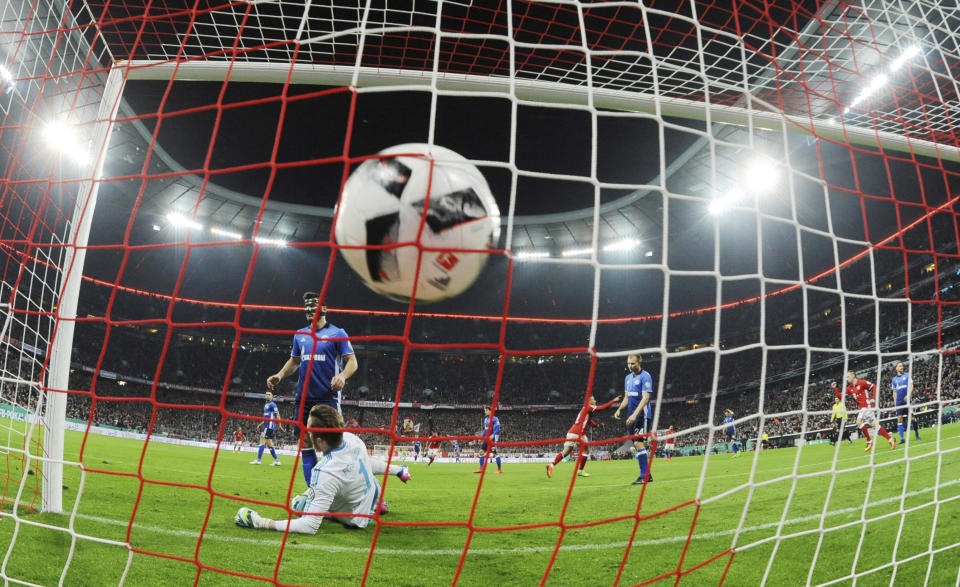 Schalke goalkeeper, Ralf Faehrmann, lies in front of the goal after Bayern's Thiago scores, during the German soccer cup quarter final match between Bayern Munich and FC Schalke 04 in the Allianz Arena in Munich, Germany, Wednesday, March 1, 2017. (Tobias Hase/DPA via AP)