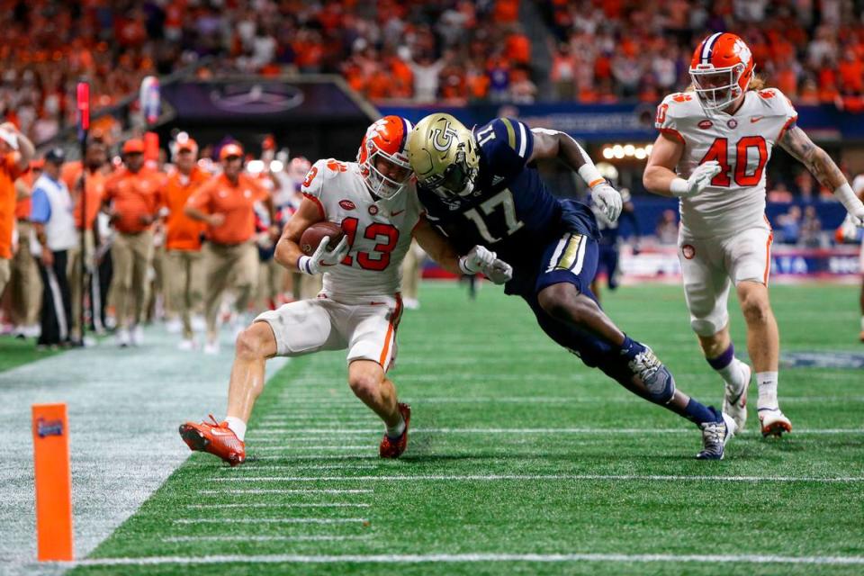 Clemson Tigers wide receiver Brannon Spector (13) is tackled by Georgia Tech Yellow Jackets linebacker Demetrius Knight II (17) in a 2022 game. Brett Davis-USA TODAY Sports