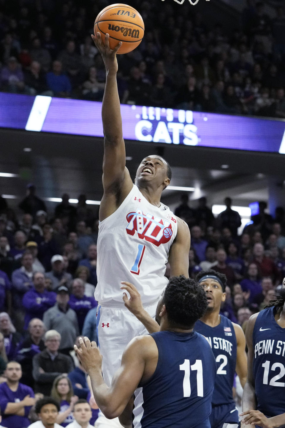 Northwestern guard Chase Audige (1) drives to the basket against Penn State guard Camren Wynter (11) during the second half of an NCAA college basketball game in Evanston, Ill., Wednesday, March 1, 2023. Penn State won 68-65. (AP Photo/Nam Y. Huh)