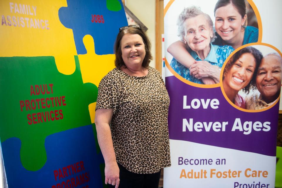 Social worker Amy Floyd poses for a photo in her office at the Alabama Department of Human Resources in Troy, Alabama, on Dec. 8, 2022.