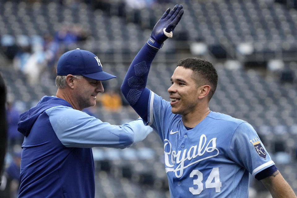 Kansas City Royals manager Matt Quatraro celebrates with Freddy Fermin (34) after their baseball game against the Chicago White Sox Thursday, May 11, 2023, in Kansas City, Mo. The Royals won 4-3. (AP Photo/Charlie Riedel)