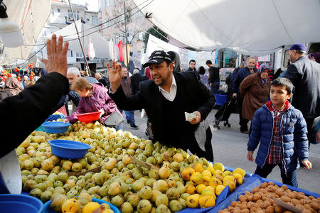 Qurbanjan Nourmuhammed shops at a local market in Istanbul, Turkey, March 10, 2019. REUTERS/Murad Sezer