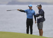 Northern Ireland's Rory McIlroy points with his club on the 5th green during the first round of the British Open Golf Championships at Royal Portrush in Northern Ireland, Thursday, July 18, 2019.(AP Photo/Peter Morrison)