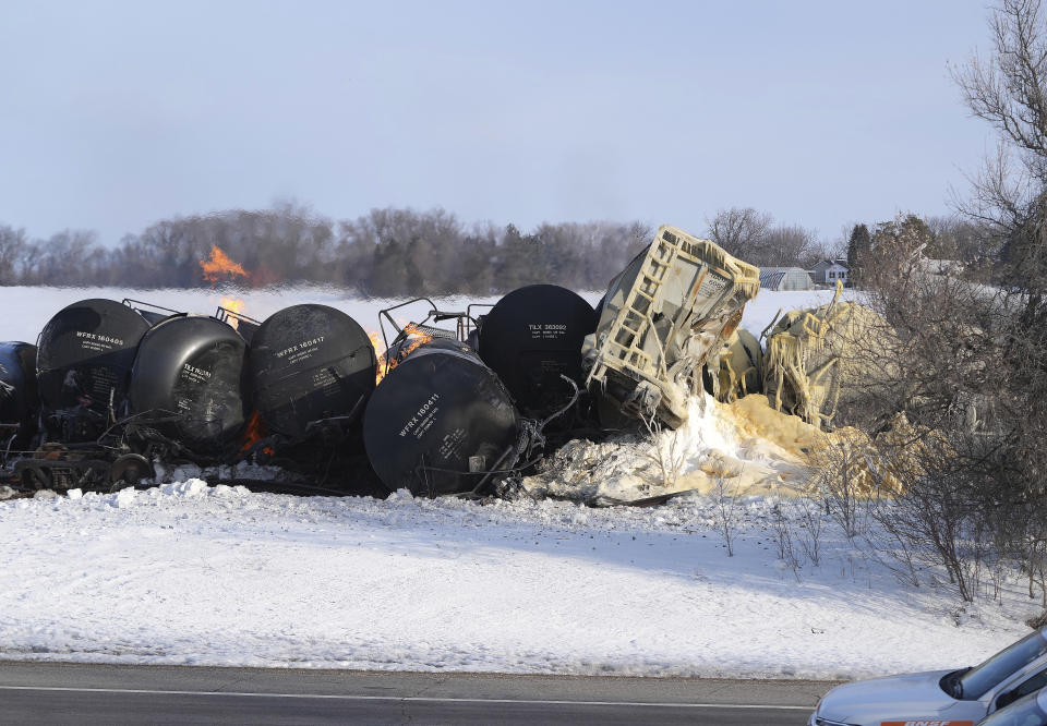 Smoke and fire appear after a BNSF train derailed in Raymond, Minn., Thursday, March 30, 2023. The train hauling ethanol and corn syrup derailed and caught fire early Thursday and nearby residents were ordered to evacuate their homes, authorities said.(David Joles /Star Tribune via AP)