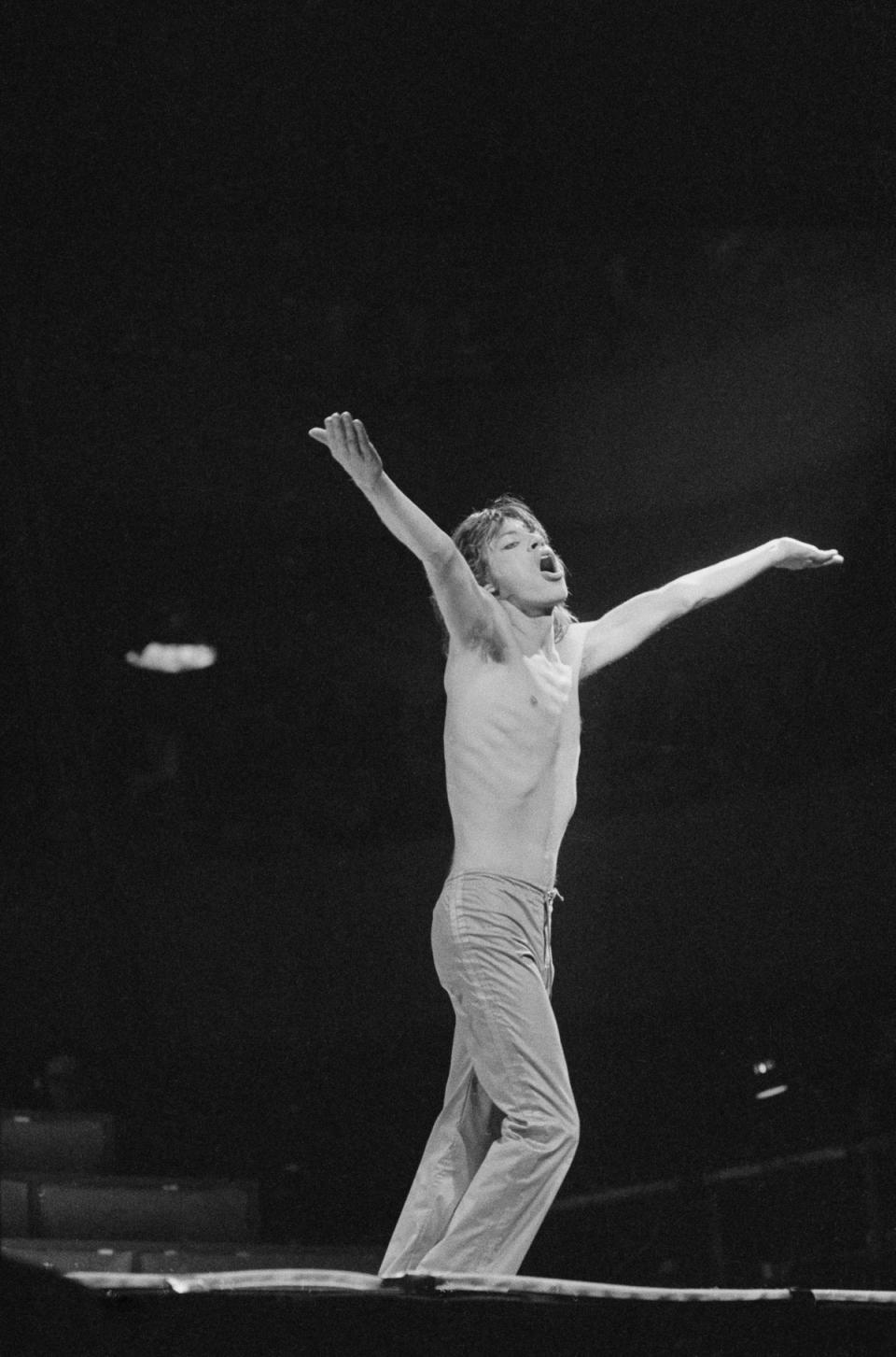 British singer Mick Jagger singing live on stage as The Rolling Stones played the Earls Court Exhibition Centre in London, England, May 1976 (Getty Images)