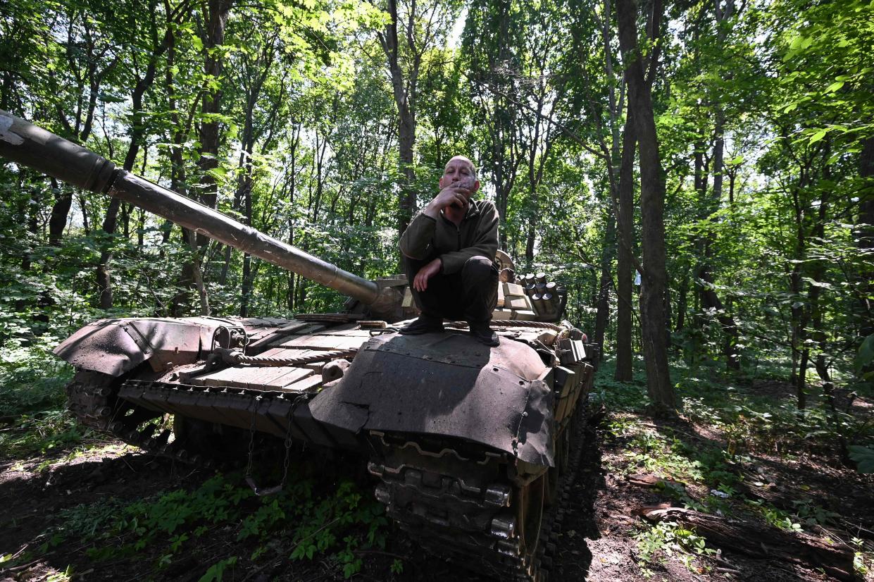 A Ukrainian tankist smokes a cigarette on a tank not far from the front line in the Kharkiv region (AFP via Getty Images)