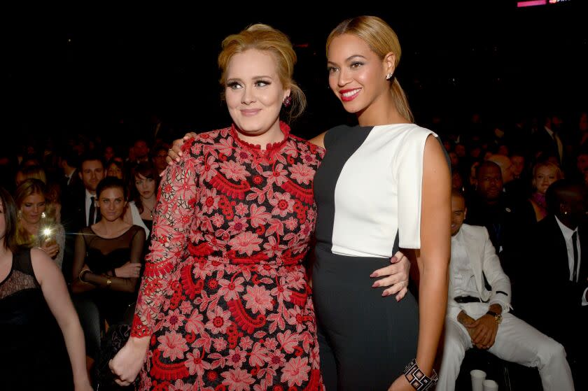 Adele (L) and Beyonce attend the 55th GRAMMY Awards at STAPLES Center on February 10, 2013.