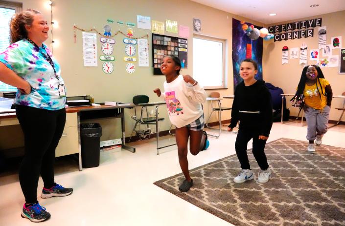 Children ages 8 to 10 have a motor break between group sessions with Susan King, therapist at Best Point Education and Behavioral Health on June 13. The nonprofit has a 2,000-plus waiting list of kids just for its mental health services, its CEO says.