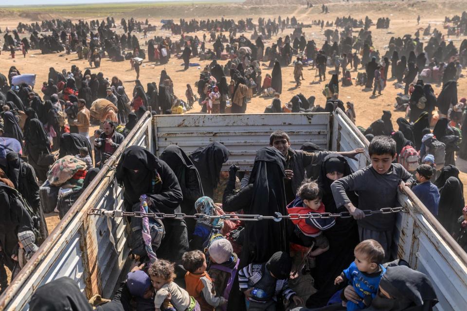 Civilians evacuated from IS stronghold Baghouz at a screening area. (AFP/Getty Images)