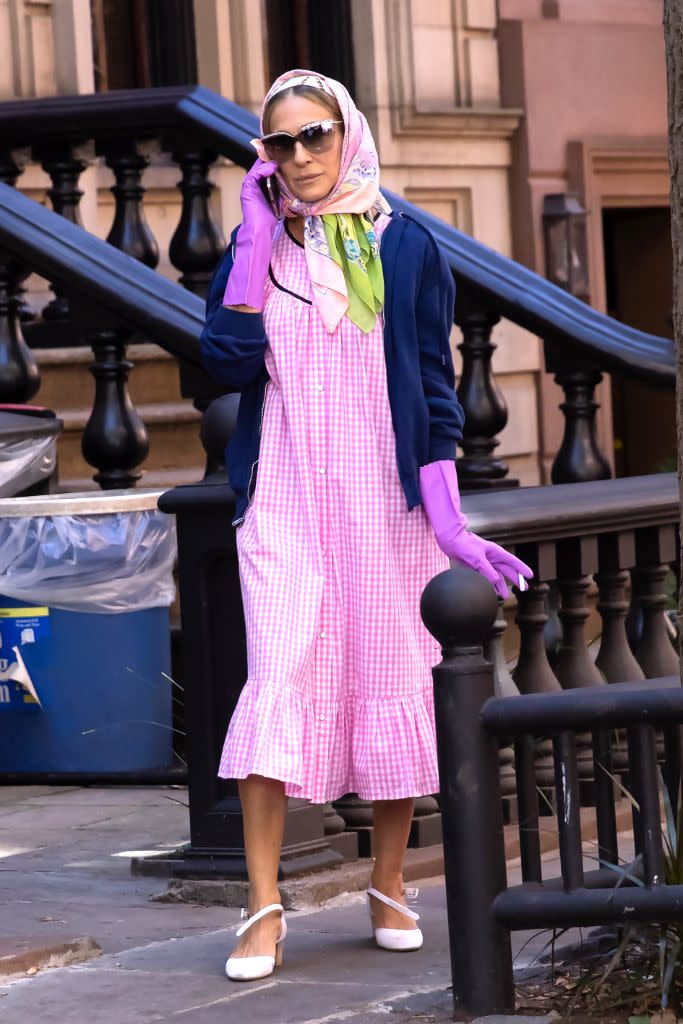 Parker on set October 20 in Manhattan, wearing a gingham dress by Batsheva. - Credit: Splash