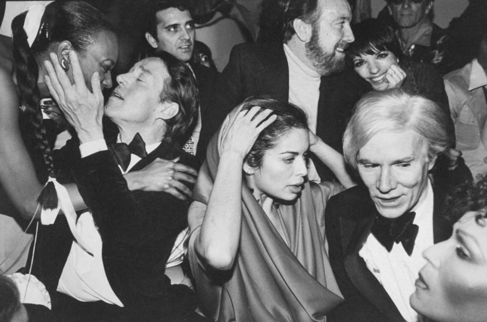 <p>Halston was a regular at New York’s iconic Studio 54. He's pictured here at a New Year’s Eve party with Bianca Jagger, Jack Haley, Jr., Liza Minnelli, and Andy Warhol.</p>