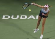 Kristina Mladenovic, of France, serves to Naomi Osaka, of Japan, during a match of the Dubai Duty Free Tennis Championship in Dubai, United Arab Emirates, Tuesday, Feb. 19, 2019. (AP Photo/Kamran Jebreili)