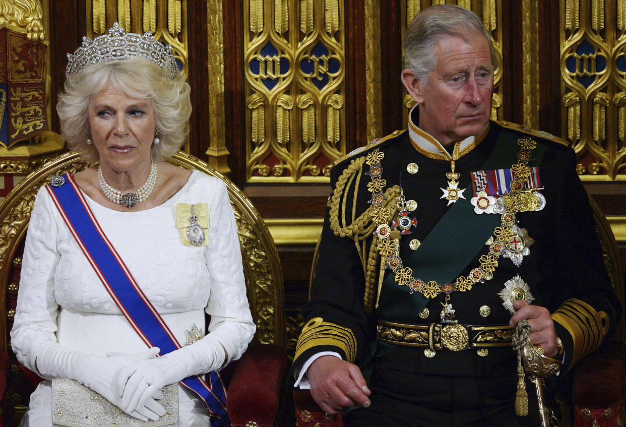 Britain's then-Prince Charles and Camilla listen as Queen Elizabeth II delivers the Queen's Speech in the House of Lords during the State Opening of Parliament, at the Palace of Westminster in London, Wednesday, June 4, 2014. (Carl Court, Pool Photo via AP)