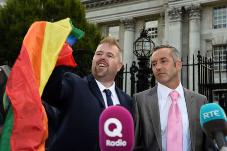 Henry and Christopher Flanagan-Kane speak to the media outside the High Court in Belfast, Northern Ireland August 17, 2017. REUTERS/Michael Cooper