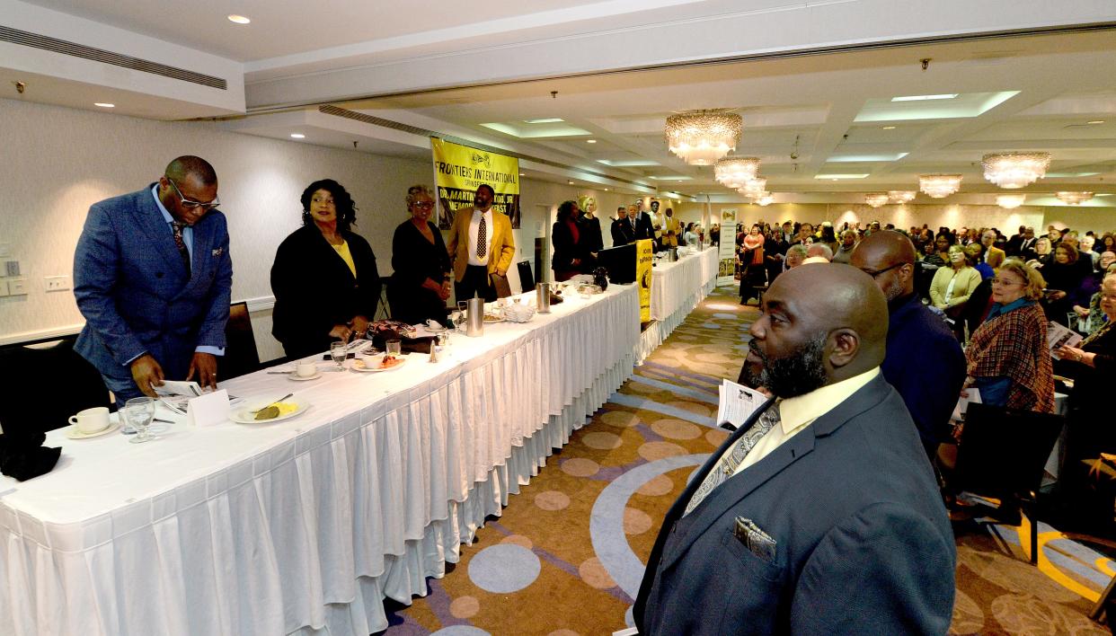 Attendees at the Springfield Frontiers International Club Martin Luther King Jr. Memorial Breakfast sing "We Shall Overcome" at the Wyndham City Centre in 2023.
