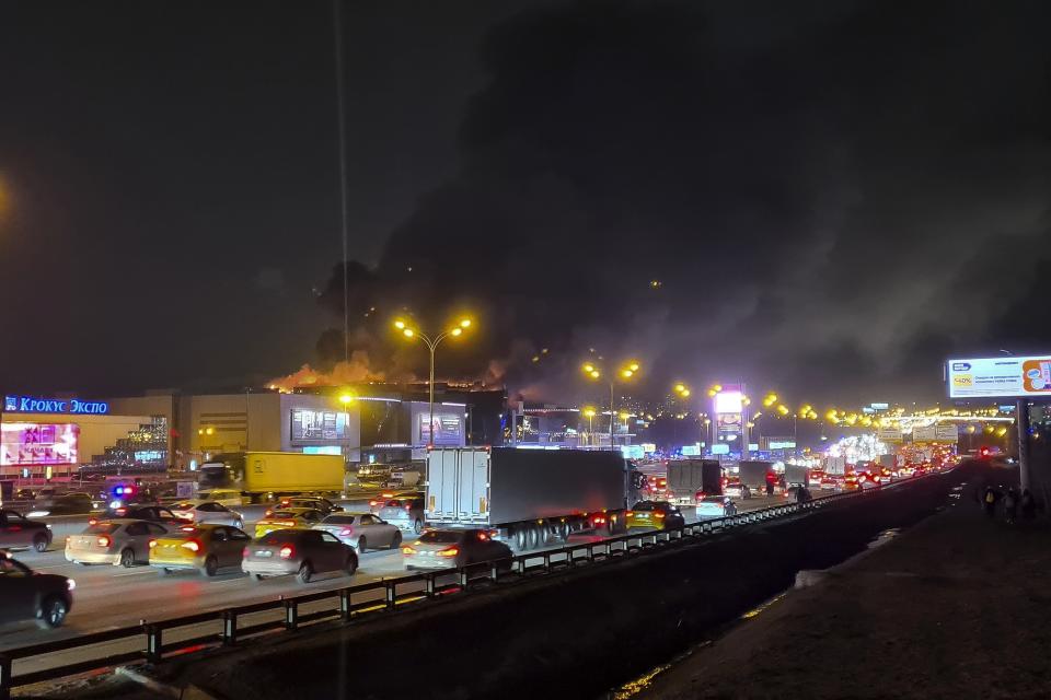 A massive blaze is seen over the Crocus City Hall on the western edge of Moscow, Russia, Friday, March 22, 2024. Several gunmen have burst into a big concert hall in Moscow and fired automatic weapons at the crowd, injuring an unspecified number of people and setting a massive blaze in an apparent terror attack days after President Vladimir Putin cemented his grip on the country in a highly orchestrated electoral landslide. (Denis Voronin/Moscow News Agency via AP)