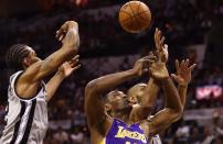 Metta World Peace (C) of the Los Angeles Lakers reaches for a rebound during the 91-79 loss to San Antonio on April 21, 2013. The Lakers were without injured superstar Kobe Bryant