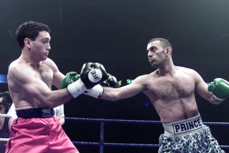 Naseem Hamed (right) exchanges punches with Manuel Calvo during their IBO Featherweight title contest