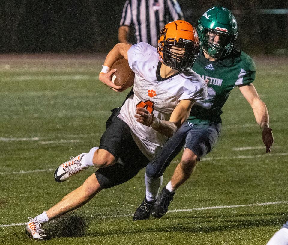 Marlborough’s Miguel Borges cuts the corner for some yardage during a game last season.