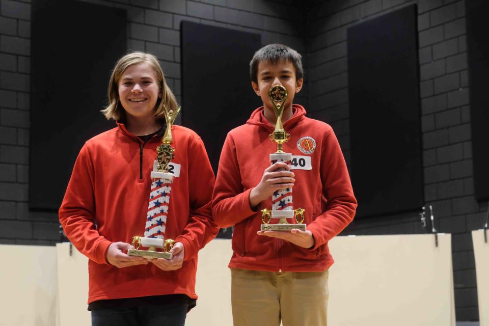 The top two finishers of the Randall County Spelling Bee, Jensen Betzen, left, and Mihir Chandra, right, celebrate their outstanding efforts in the competition.