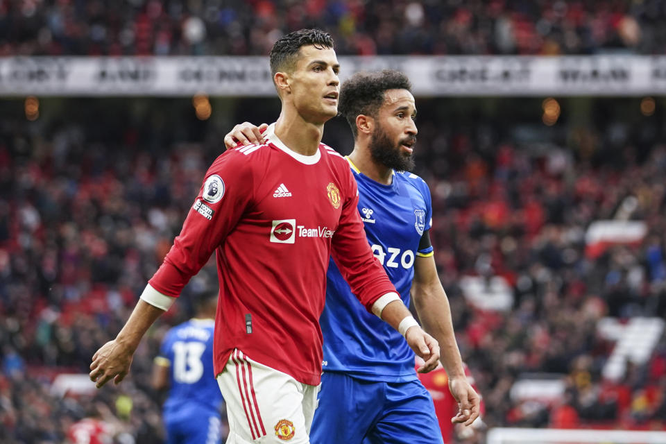 Manchester United's Cristiano Ronaldo and Everton's Andros Townsend walk off the pitch at the end of the English Premier League soccer match between Manchester United and Everton, at Old Trafford, Manchester, England, Saturday, Oct. 2, 2021. The match ended in a 1-1 draw. (AP Photo/Dave Thompson)