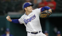 Texas Rangers starting pitcher Spencer Howard throws during the first inning of a baseball game against the Chicago White Sox, Saturday, Sept. 18, 2021, in Arlington, Texas. (AP Photo/Brandon Wade)