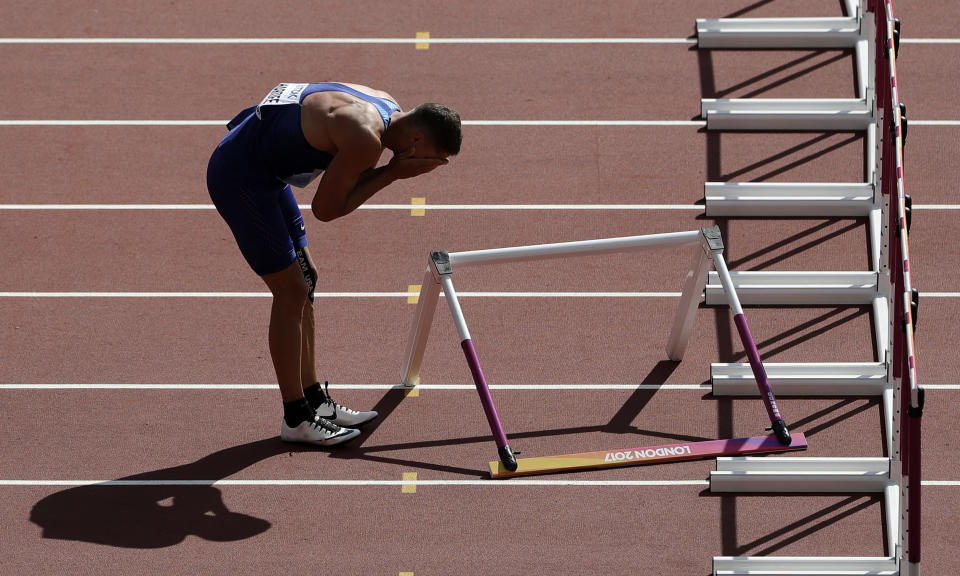 FILE - United States' Trey Hardee reacts after falling in the 110-meter event of the decathlon during the World Athletics Championships in London Saturday, Aug. 12, 2017. (AP Photo/Tim Ireland, File)