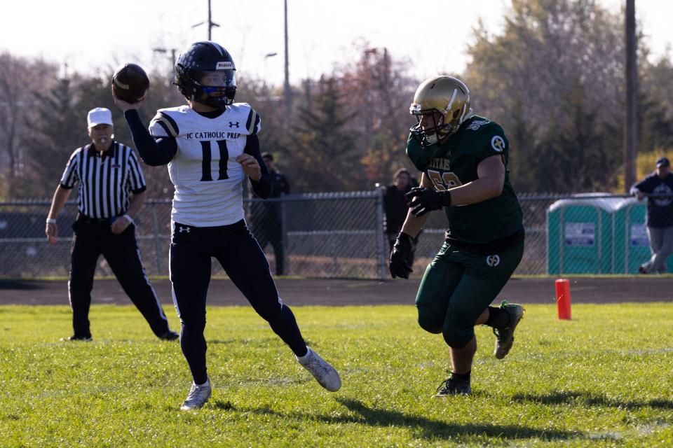 IC Catholic Prep Dennis Masala (11) lines up to throw the ball downfield while Boylan Catholic Maxton Montoya (52) follows closely behind during a game at Boylan Catholic high school on Nov. 4, 2023.