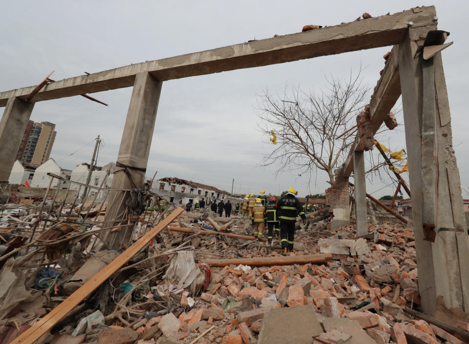 <p>Rescue workers are seen at the site of an explosion in Ningbo, China’s eastern Zhejiang province on Nov. 26, 2017. (Photo: STR/AFP/Getty Images) </p>