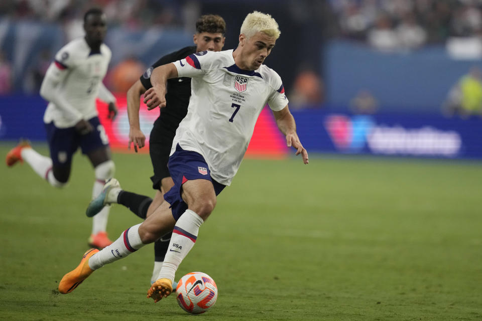 Giovanni Reyna of the United States drives up the field against Canada during the first half of a CONCACAF Nations League final match Sunday, June 18, 2023, in Las Vegas. (AP Photo/John Locher)