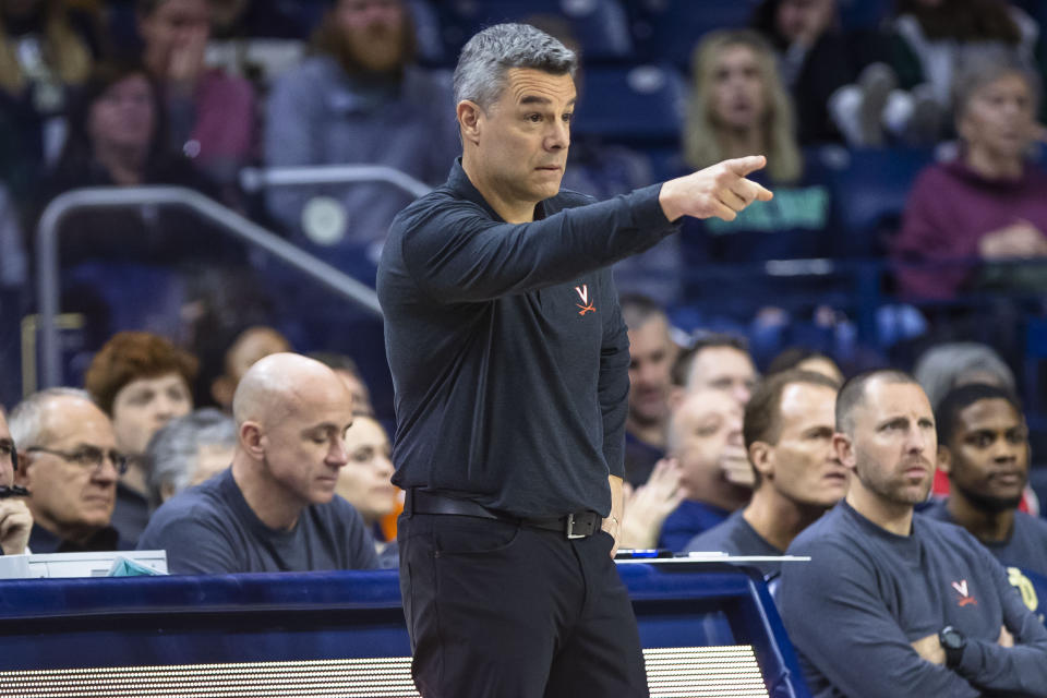 Virginia head coach Tony Bennett gestures to his players during the first half of an NCAA college basketball game on Saturday, Dec. 30, 2023, in South Bend, Ind. (AP Photo/Michael Caterina)