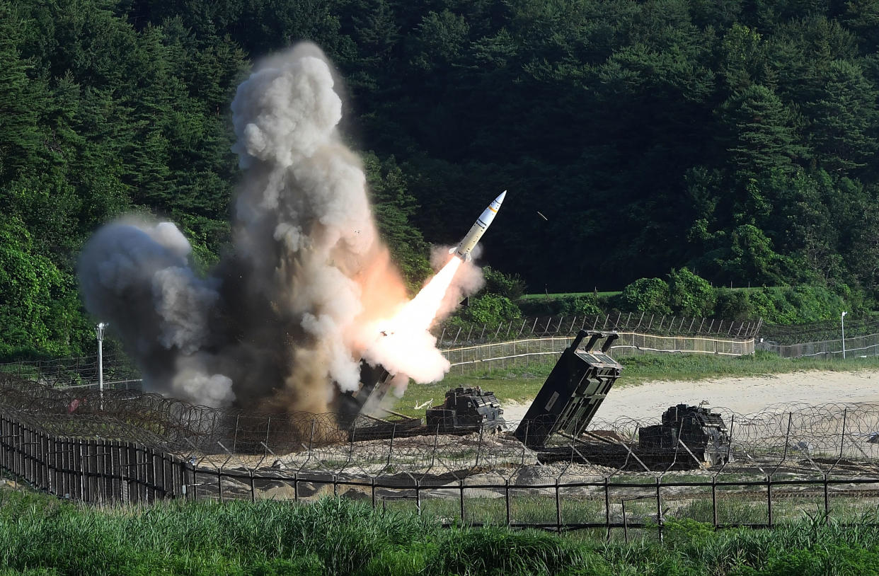 A multiple launch rocket system fires a missile.