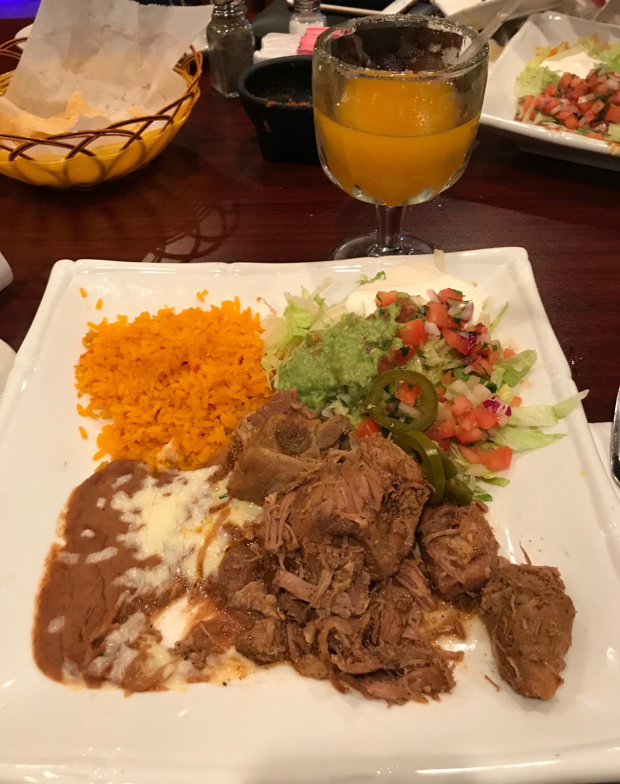 The carnitas plate and the mango margarita from Blue Margaritas Bar and Grill in Washington.