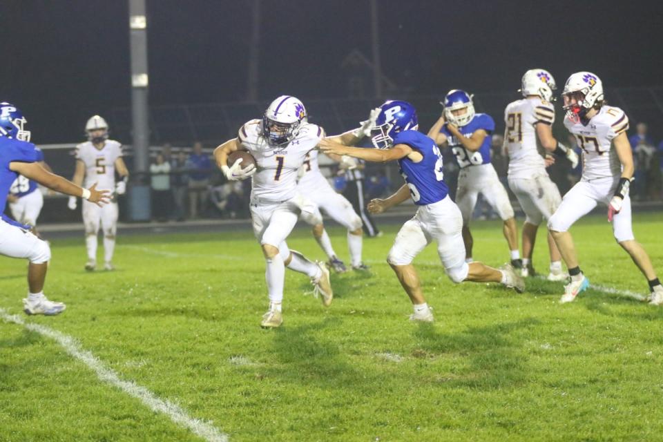 Nevada's Kyle Kingsbury runs the ball down the field against Perry on Friday, Sept. 22, 2023, at Dewey Field in Perry.