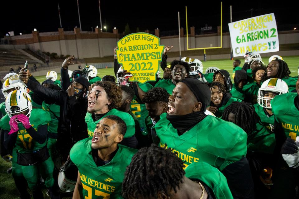 Carver players celebrate the win and regional championship after the game at Cramton Bowl in Montgomery, Ala., on Thursday, Oct. 20, 2022. Carver defeated Pike Road 22-19.