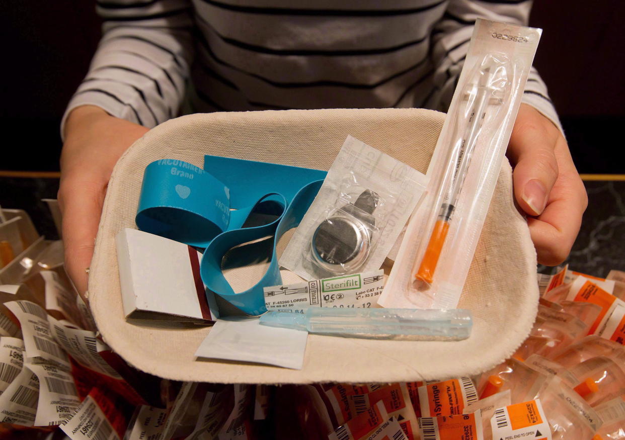 Registered nurse Sammy Mullally holds a tray of supplies to be used by a drug addict at the Insite safe injection clinic in Vancouver, B.C., on Wednesday May 11, 2011. Health Canada has approved a supervised consumption site in Victoria to allow people to inject illicit drugs in the presence of medical staff. (The Canadian Press/Darryl Dyck)