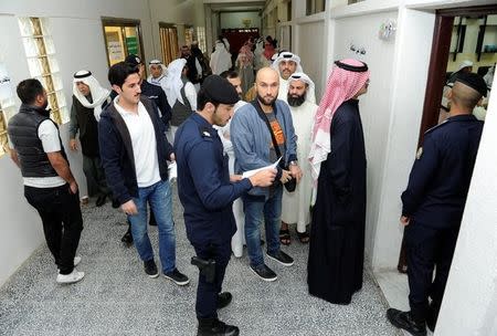 Kuwaiti men arrive to cast their votes during parliamentary election in a polling station in Kuwait City, Kuwait November 26, 2016. REUTERS/Stringer