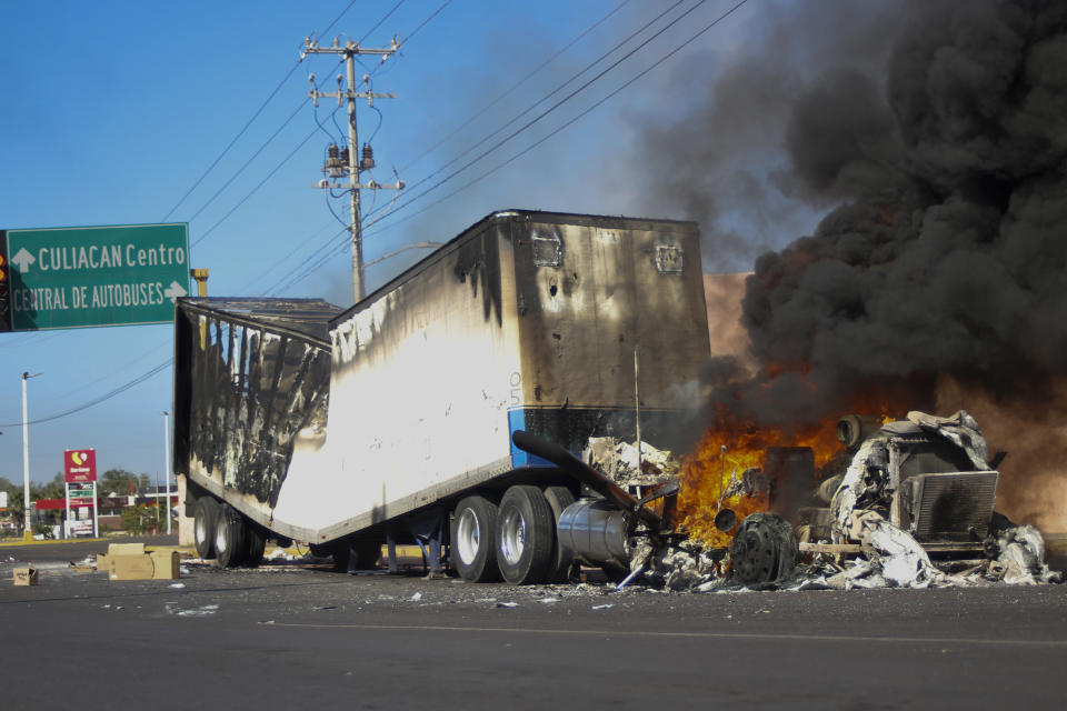 A truck burns on a street in Culiacan, Sinaloa state, Thursday, Jan. 5, 2023. Mexican security forces captured Ovidio Guzmán, an alleged drug trafficker wanted by the United States and one of the sons of former Sinaloa cartel boss Joaquín “El Chapo” Guzmán, in a pre-dawn operation Thursday that set off gunfights and roadblocks across the western state’s capital. (AP Photo/Martin Urista)