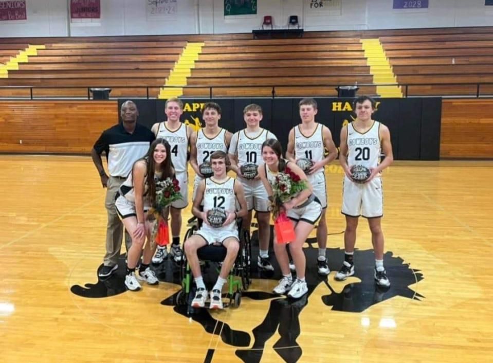 Charles Byrd (far left) poses with members of the Happy boys and girls basketball teams.