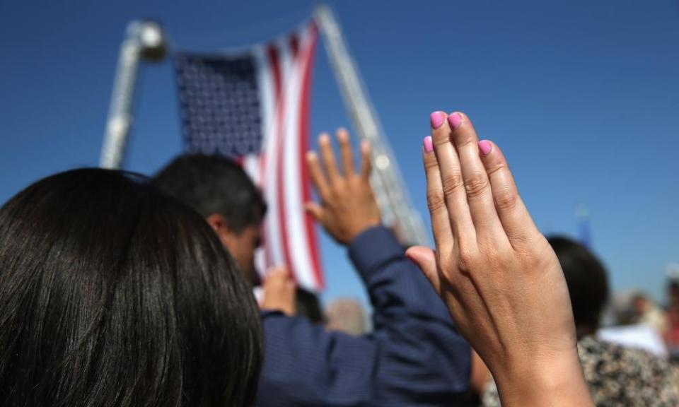 Immigrants become American citizens during a naturalization ceremony.