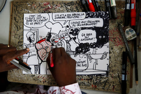 Thembo Kashauri, Democratic Republic of Congo's best-known political cartoonist is seen as he draws in an office in Kinshasa, Democratic Republic of Congo, December 26, 2018. REUTERS/Baz Ratner