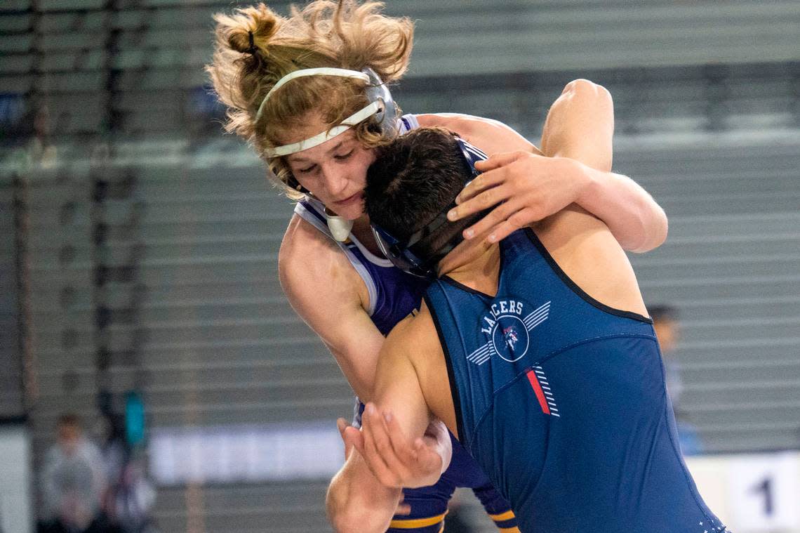 Sumner’s Cody Miller looks to take Kennedy Catholic’s Mathias Collins to the mat during their 152-pound 4A championship match at Mat Classic XXXIII on Saturday, Feb. 19, 2022, at the Tacoma Dome in Tacoma, Wash. Miller won the match by decision, 4-3.