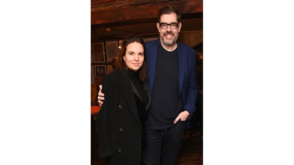 Ingrid Oliver in a black jacket with her husband Richard Osman in a blue suit