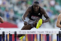 Grant Holloway, right, wins the final in the men's 110-meter hurdles at the U.S. Olympic Track and Field Trials Saturday, June 26, 2021, in Eugene, Ore. (AP Photo/Ashley Landis)