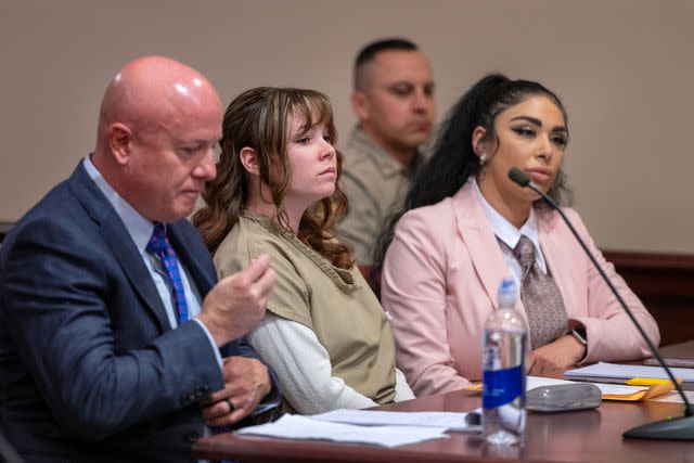 <p>Eddie Moore-Pool/Getty</p> Hannah Gutierrez Reed, center, with her attorney Jason Bowles and paralegal Carmella Sisneros on April 15