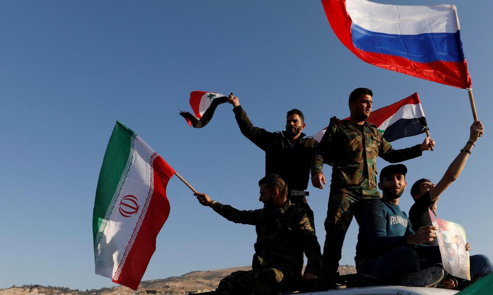 Syrians in Damascus wave Iranian, Russian and Syrian flags