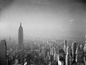 <p>The German-built zeppelin Hindenburg, right, floats over the Manhattan skyline on Aug. 8, 1936. The Empire State Building, measuring 1,250 feet in height, can be seen at left. (AP Photo) </p>