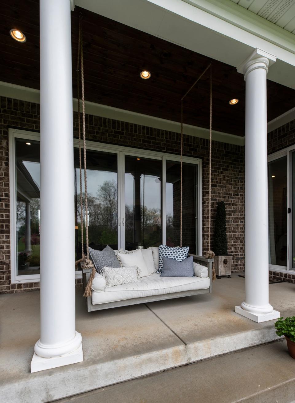 A suspended swing on the basic porch of Kim Smith's home in a North Oldham neighborhood of Kentucky. April 21, 2022