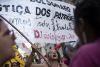 A woman shouts during a protest against layoffs at the state oil company Petrobras, in Rio de Janeiro, Brazil, Tuesday, Feb. 18, 2020. Brazilian oil workers and oil giant Petrobras were locked in a power struggle Tuesday over the company's privatization plans, with the union saying thousands of employees are on an indefinite strike. (AP Photo/Silvia Izquierdo)