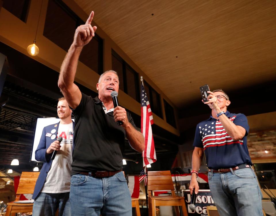 Alfie Oakes, center, stands alongside Retired Lt. Gen. Michael Flynn and addresses the crowd during an election results watch party at Seed to Table in Naples Tuesday November 8, 2022.